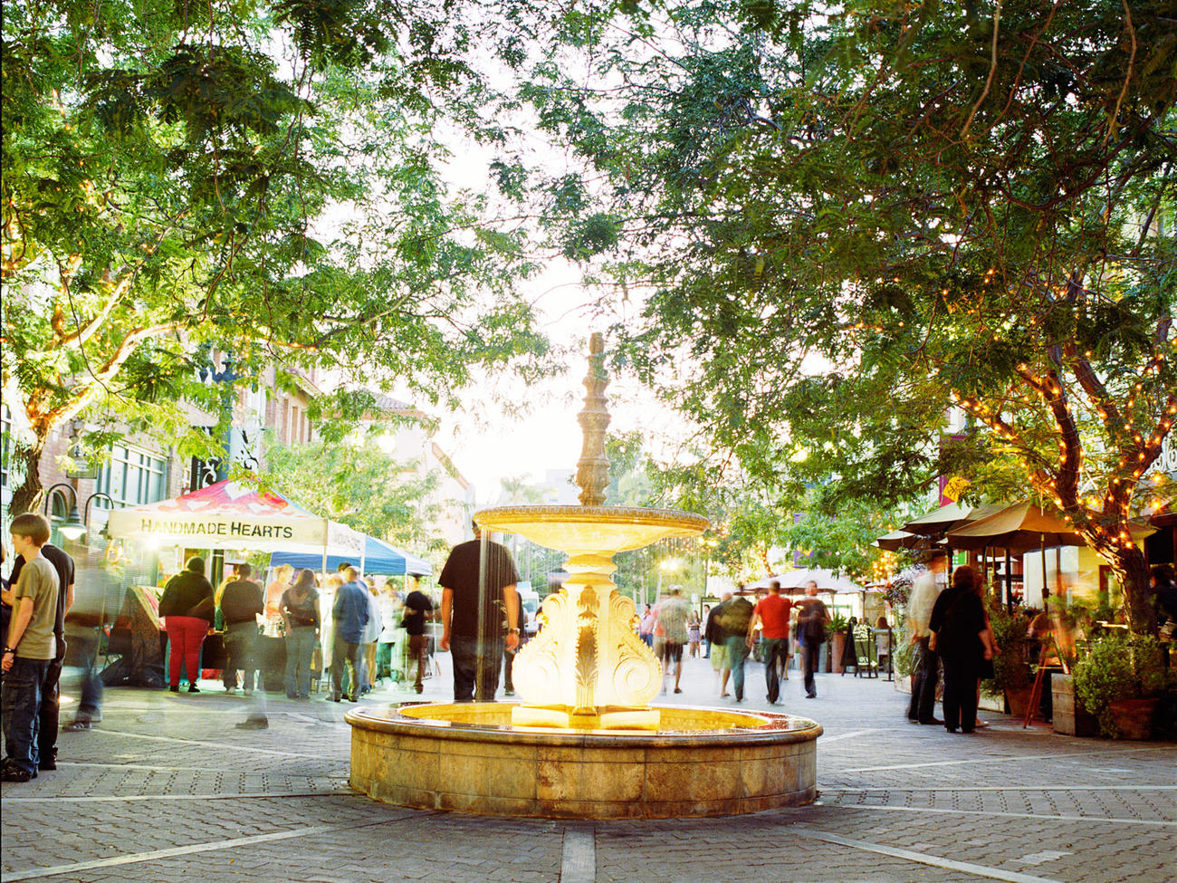 Artists Village street scene with colorful murals and galleries